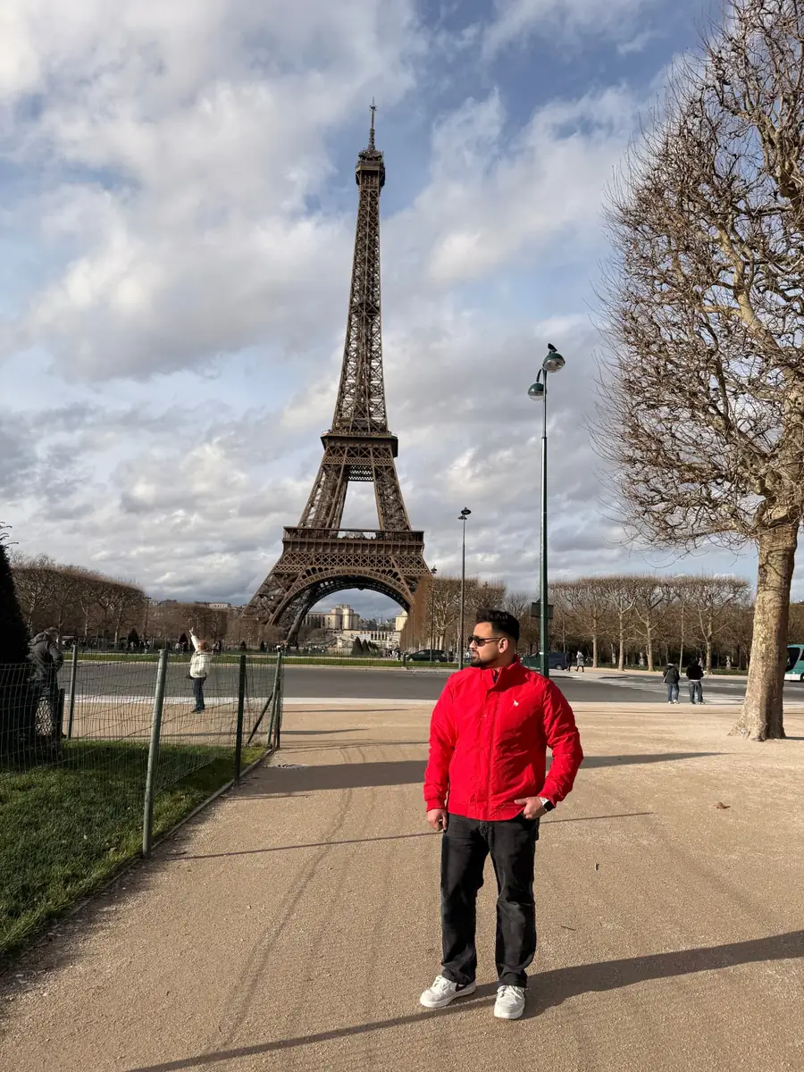 Fatik Rahman in front of the Eiffel Tower, Paris